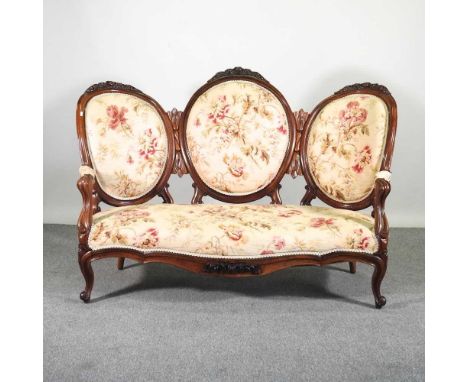 A 19th century carved walnut and floral upholstered show frame sofa, on cabriole legs161w x 88d x 109h cm