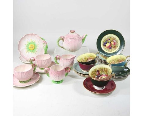 An Aynsley harlequin set of cabinet cups, saucers and plates, printed with fruit, together with a 1930's Carltonware Pink But
