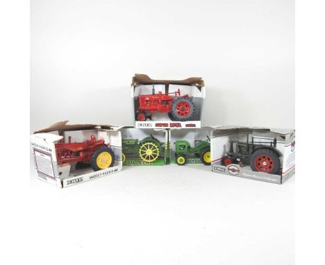 An Ertl 1/16 scale model Massey Harris 44 tractor, a Massey-Harris Challenger, a Super M-TA Farmall and two John Deere models