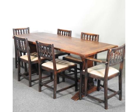 A 1960's Ercol dining suite, comprising a refectory table and a set of six matching dining chairs (7)188w x 74d x 75h cm