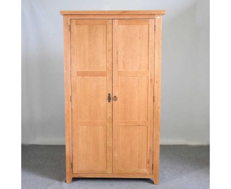 A modern light oak double wardrobe110w x 60d x 191h cm