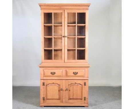 A modern light oak glazed cabinet bookcase97w x 42d x 193h cm 