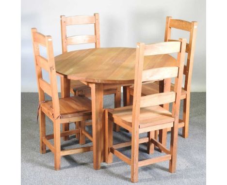 A modern light oak circular dining table, together with a set of four modern ladderback dining chairs (5)110w x 77h cm
