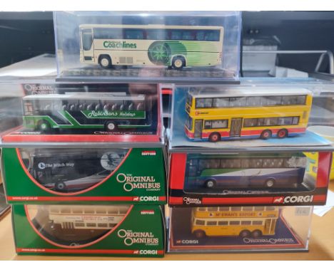 Collection of seven cased Corgi buses (7)
