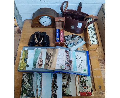 Selection of items to include a dominos set, pair of binoculars, a vintage postcard album, a playing cards box, mantle clock 