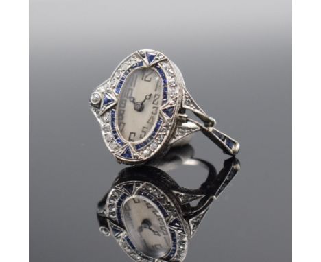 NOTSERP WATCH Co. ausgefallene Ringuhr in WG 750/000 mit Diamanten &amp; Saphiren,  Handaufzug, Schweiz um 1910, reich verzie