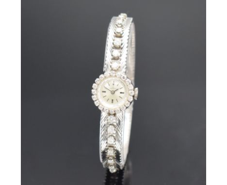 BISCHOFF Damenarmbanduhr in WG 750/000 mit Diamanten,  Schweiz um 1965, Handaufzug, Geh. an Goldband in WG 750/000, Boden auf