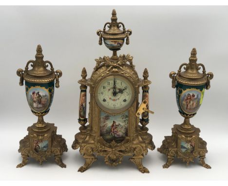 A 19th century French style gilt metal and ceramic clock garntiture, the movement marked Franz Hemle. H.41cm