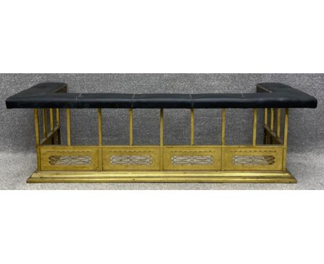 A 19th century brass club fender with leather upholstered seat. H.47 W.154 D.60cm. 