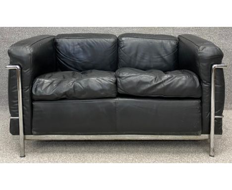 After a design by Le Corbusier for Cassina an LC2 sofa in black upholstery, stamped and with Cassina label. H.70 W.129 D.69cm
