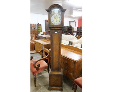 An early 20th Century oak dwarf longcase clock