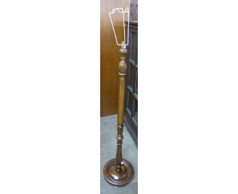 A carved beech standard lamp 