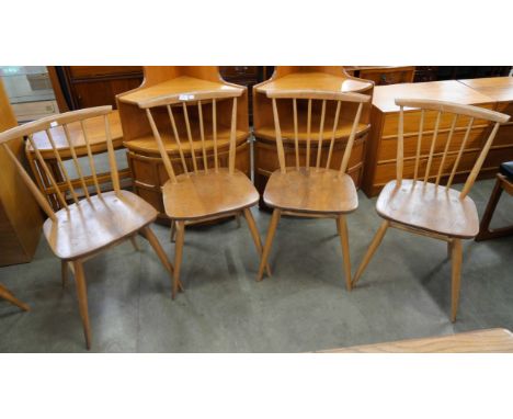 A set of four Ercol Blonde elm and beech chairs 