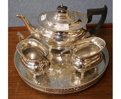 A silver plated three piece tea service and a tray