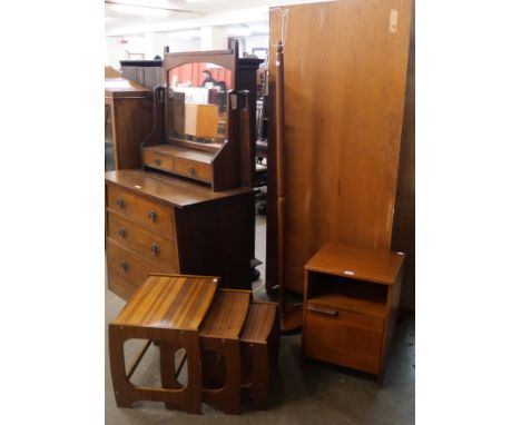 A teak bedside cabinet, a nest of tables and a standard lamp 