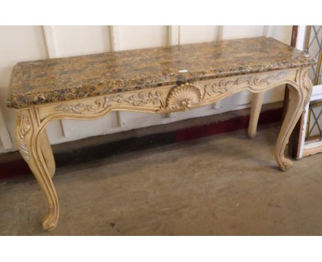 An Italian Rococo style painted faux marble console table 