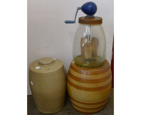 A vintage butter churn and two bottles 