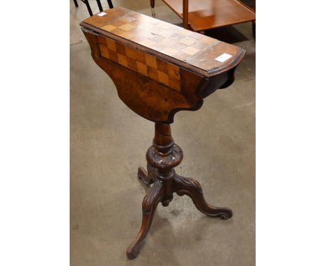 A Victorian inlaid walnut drop leaf tripod games table 