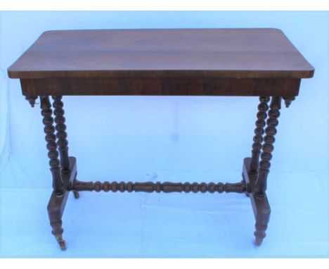 A 19TH CENTURY ROSEWOOD RECTANGULAR TOPPED CENTRE TABLE supported on four bobbin turned legs, united by a bobbin turned stret