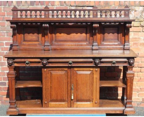 A LATE 19TH CENTURY OAK BUFFET STYLE SIDEBOARD, having decorative baluster gallery upright, with single shelf, scrolling colu