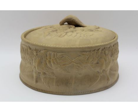 A LATE 19TH CENTURY BISQUE (pastry effect) GAME PIE DISH, moulded dead game decoration of oval form, 28cm x 21cm 