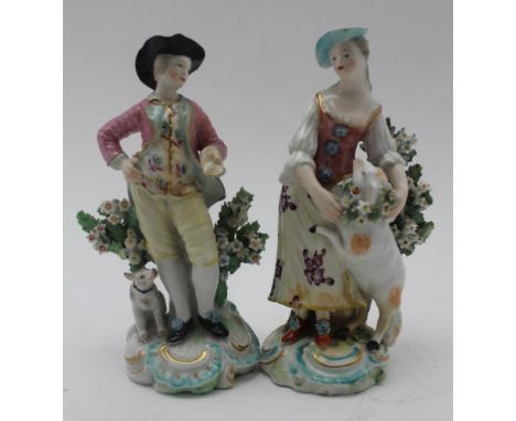 A PAIR OF DERBY PATCH MARK FIGURES The Garland Shepherds, he wears a broad brimmed hat, pink jacket, a dog at his side, she p