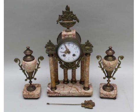 A LATE 19TH CENTURY FRENCH CLOCK GARNITURE, the clock brass &amp; red veined marble, with architectural column form, having a