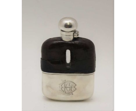 AN EDWARDIAN SILVER MOUNTED HIP FLASK, silver screw cap and removable cup, crocodile covered shoulder, Sheffield 1904, 13cm h