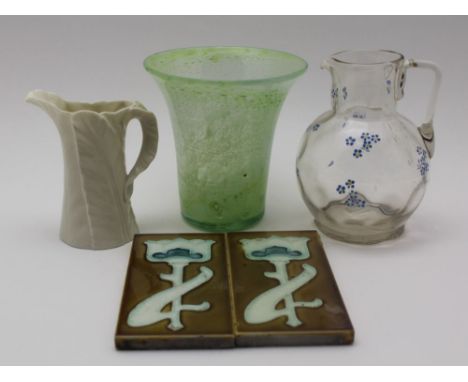 A ROYAL WORCESTER PORCELAIN LEAF FORM JUG, 12cm high, two Art Nouveau tiles, a flared rim vase, possibly Monart, 14cm and a g