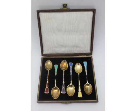 TURNER &amp; SIMPSON, A CASED SET OF SIX SILVER GILT &amp; ENAMEL COFFEE SPOONS, Harlequin of guilloche enamel, Birmingham 19