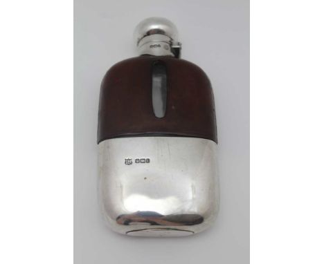 FREDERICK C. ASMAN &amp; CO., AN EDWARDIAN SILVER &amp; LEATHER COVERED GLASS HIP FLASK, turn cap and removeable cup base, Sh