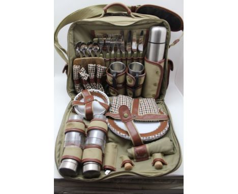 A 'CONCEPT' PICNIC SET, green canvas bag, with pouches, contains stainless steel flask, cutlery &amp; accessories, for four 