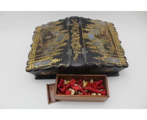A 19TH CENTURY PAPIER MACHE DESK BOX, two hinged lids, each gilded and bearing architectural landscapes, 28cm x 20cm, togethe