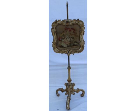 A 19TH CENTURY POSSIBLE ITALIAN GESSOED POLE SCREEN with insert tapestry panel, depicting flora & forna, on a brass pole, wit