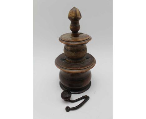 AN 18TH CENTURY LIGNUM VITAE COFFEE GRINDER, turned in sections, removable cover, the central mechanism section unscrews to r