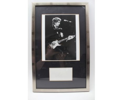 BOB DYLAN AUTOGRAPH (quite faded), mounted together with a photograph, silvered frame, black mount, glazed overall size, 48cm