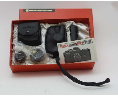 AN ASAHI PENTAX AUTO 110 CAMERA SYSTEM, set in original box, with booklet 
