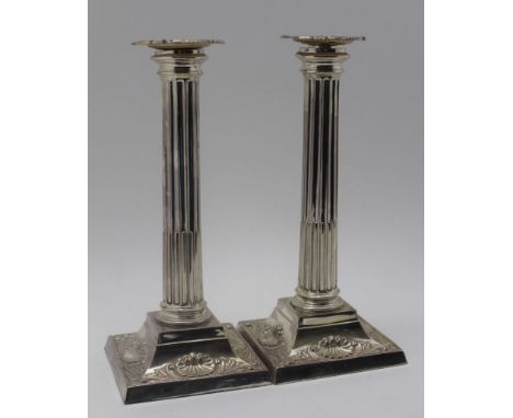 HARRISON BROTHERS & HOWSON (George Howson), A PAIR OF SILVER CANDLESTICKS, classical fluted column design, on square scallop 