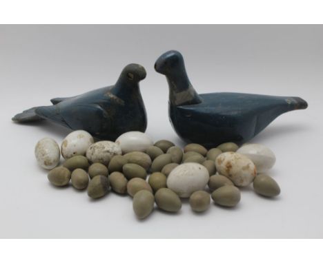 TWO EARLY TO MID 20TH CENTURY CARVED WOOD &amp; PAINTED DECOY PIGEONS, together with a quantity of painted wood pheasant eggs