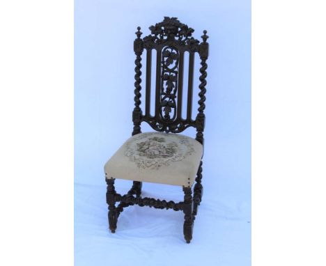 A LATE 19TH CENTURY CAROLEAN DESIGN SINGLE CHAIR, with green man mask crest rail, grape &amp; vine central section, flanked b