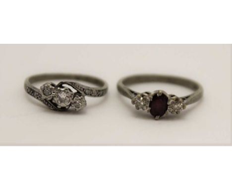 TWO 18CT GOLD LADY'S RINGS, on set three diamonds, one a ruby flanked by two diamonds, one size 'M', the other 'K1/2' (2) 