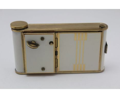 A MID 20TH CENTURY COMBINATION CIGARETTE CASE, COMPACT, LIPSTICK HOLDER, brass and cream panelled 9.5cm x 5cm 
