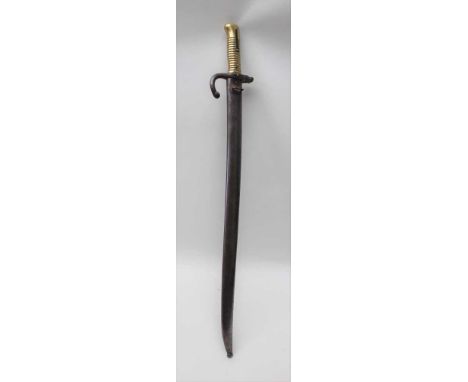 A 19TH CENTURY FRENCH INFANTRY BAYONET blade appears unmarked, the guard impressed 15801, housed in period polished steel sca