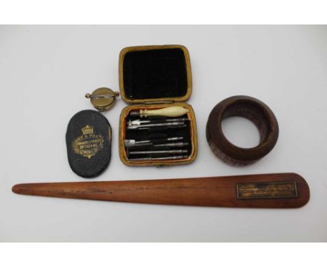 AN EARLY 19TH CENTURY MINIATURE TOOL KIT, a turned bone handle with interchangeable steel tips, in original red box, 6.5cm x 