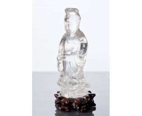 CHINESE ROCK CRYSTAL FIGURE OF BUDDHA
the standing figure holding a scroll or parchment on a carved wooden stand, 21cm high o