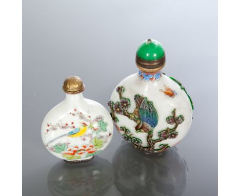 TWO CHINESE SNUFF BOTTLES 
one in glass in green and white, 8cm high; the other Canton enamel with birds and flowers, 6.5cm h