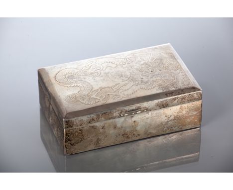20TH CENTURY CHINESE SILVER CIGARETTE CASKET
the hinged lid engraved with a dragon chasing a pearl, the wood lined interior w