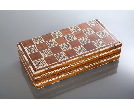 AFRICAN TRAVELLING CHESS SET
c.1930s, complete with ivory figures carved as Egyptian gods, the wooden board inlaid with ivory