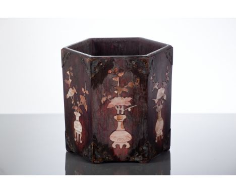 CHINESE WOODEN AND MOTHER OF PEARL BRUSH POT 
of hexagonal form and with flowers in vases inlay and with metal mounts to the 