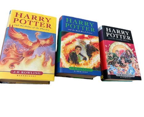 Three First Edition Harry Potter books to include the Half-Blood Prince with rare page 99 printing error with the misprint 'e